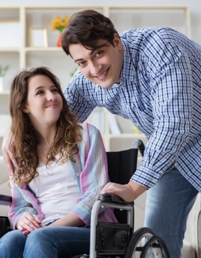 Friendly staff from an NDIS Provider in Cannington assisting a participant with daily living activities in a bright home setting.